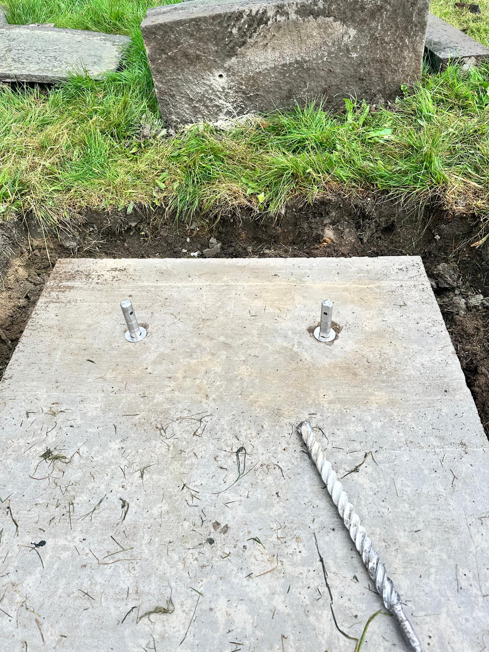 Stainless-steel safety fixings installed in the concrete base